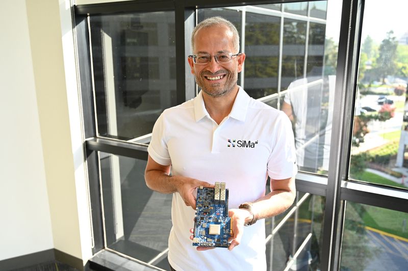 &copy; Reuters. SiMa.ai CEO Krishna Rangasayee poses for a picture with his machine learning system used for processing video and images for security cameras, satellite images, drones, industrial robots, and eventually self-driving cars in, San Jose, California, U.S., in