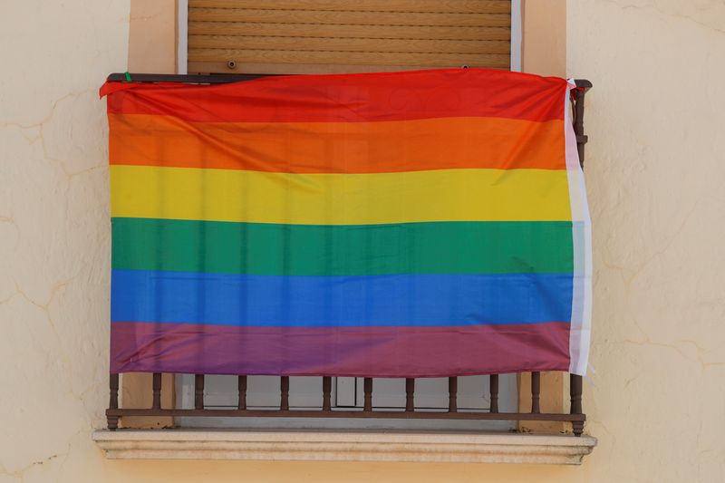 &copy; Reuters. FILE PHOTO: A rainbow flag hangs from the window of a house during the International LGBT Pride Day, in Villanueva de Algaidas, southern Spain June 28, 2020. REUTERS/Jon Nazca