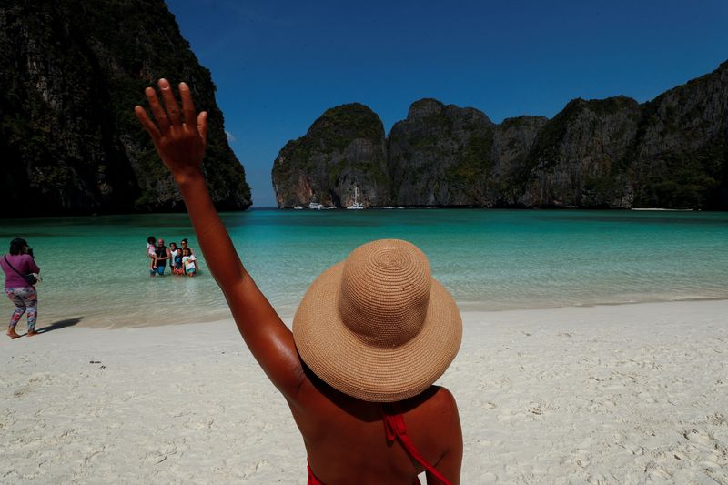 &copy; Reuters. FILE PHOTO: Tourists visit Maya Bay as Thailand reopens its world-famous beach after closing it for more than three years to allow its ecosystem to recover from the impact of overtourism, at Krabi province, Thailand, January 3, 2022. REUTERS/Jorge Silva