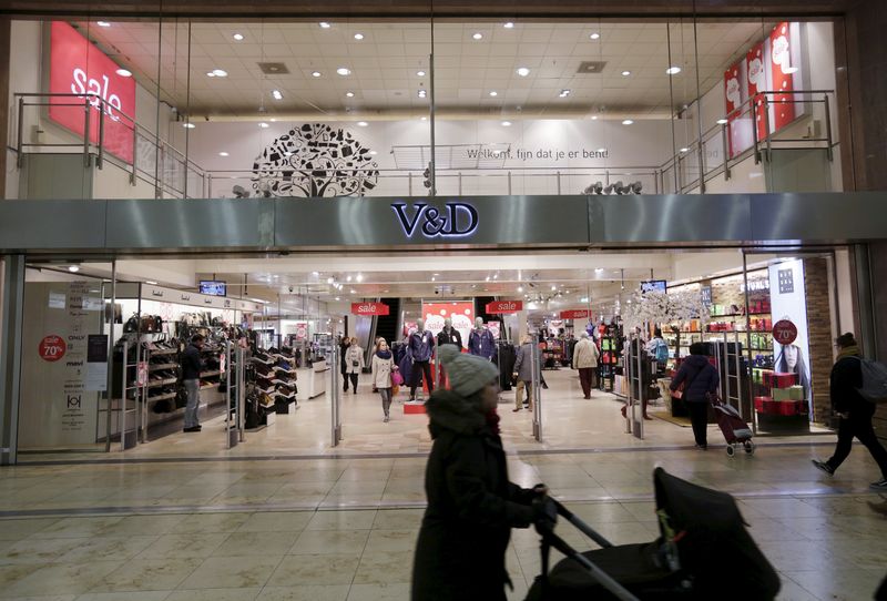 &copy; Reuters. FILE PHOTO: Shoppers pass by under sale signs at a Vroom & Dreesmann (V&D) department store in Utrecht, the Netherlands January 19, 2016.   REUTERS/Michael Kooren