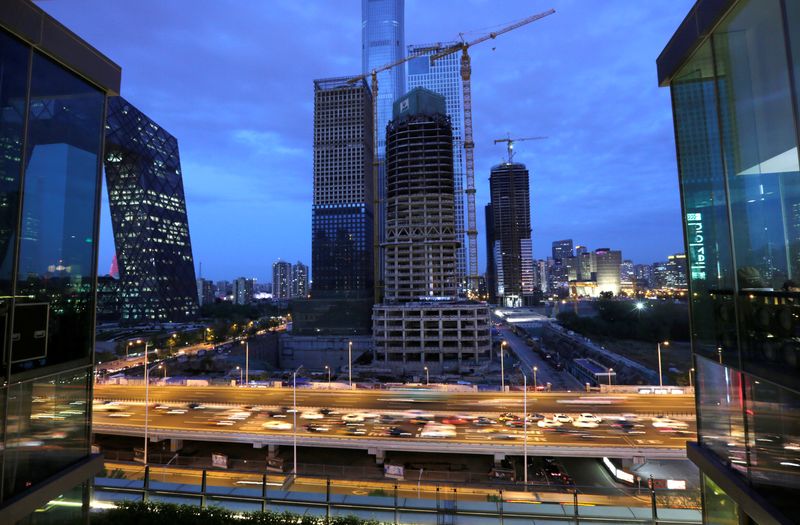 &copy; Reuters. FILE PHOTO: Vehicles drive through Beijing's central business area, China April 23, 2018. REUTERS/Jason Lee