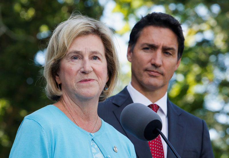 © Reuters. Newly sworn-in Minister of Public Services and Procurement Helena Jaczek speaks to the media as Canada's Prime Minister Justin Trudeau looks on after a cabinet shuffle in Ottawa, Ontario, Canada, August 31, 2022.  REUTERS/Patrick Doyle