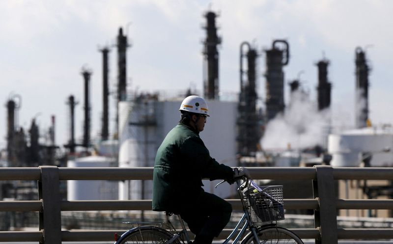 &copy; Reuters. FILE PHOTO: A worker cycles near a factory at the Keihin industrial zone in Kawasaki, Japan February 17, 2016.   REUTERS/Toru Hanai/File Photo