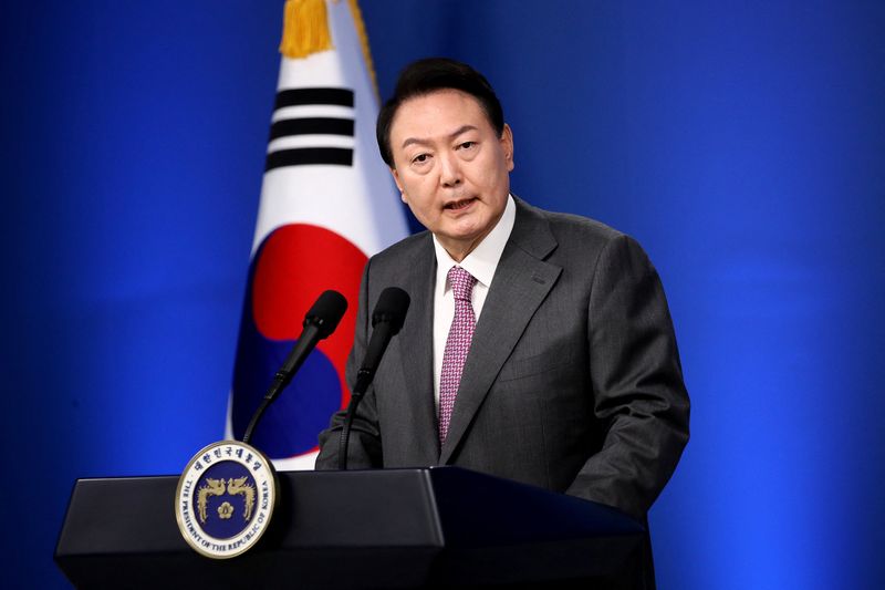 &copy; Reuters. FILE PHOTO: South Korea's President Yoon Suk-yeol holds first official news conference, after taking office in May, to mark 100 days in office, in Seoul, South Korea August 17, 2022. Chung Sung-Jun/Pool via REUTERS