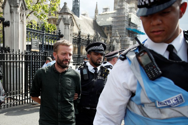&copy; Reuters. Police officers detain one of the Extinction Rebellion activists who protested at the Houses of Parliament in London, Britain September 2, 2022. REUTERS/Peter Nicholls