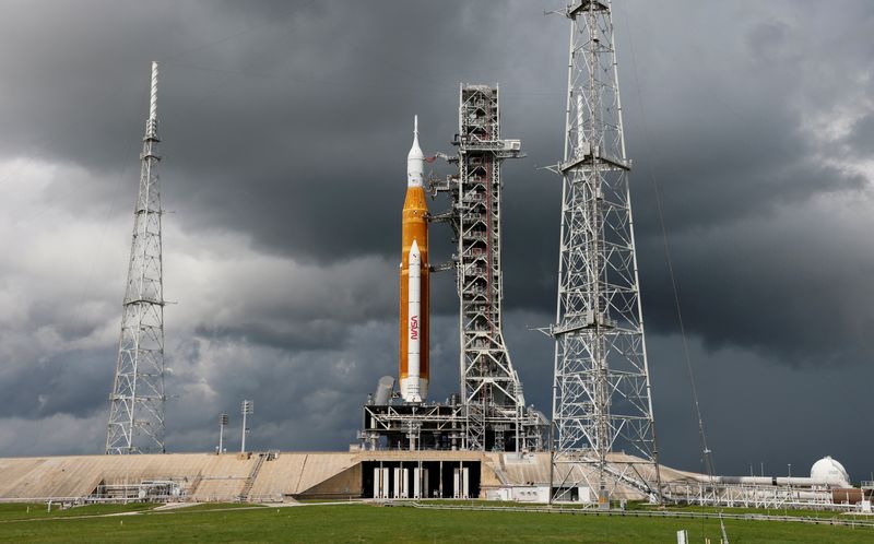 &copy; Reuters. NASA's next-generation moon rocket, the Space Launch System (SLS) with the Orion crew capsule perched on top, stands on launch complex 39B as rain clouds move into the area before its rescheduled debut test launch for the Artemis 1 mission at Cape Canaver