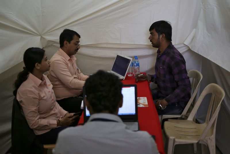 &copy; Reuters. FILE PHOTO: A job seeker is interviewed by human resource managers at a job fair in Chinchwad, India, February 7, 2019. REUTERS/Danish Siddiqui