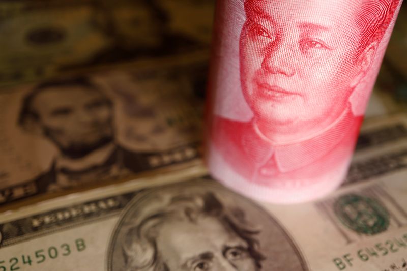 &copy; Reuters. U.S. Dollar and Chinese Yuan banknotes are seen in this illustration picture taken June 14, 2022. REUTERS/Florence Lo/Illustration