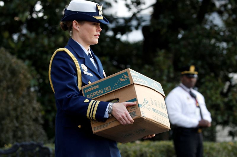 &copy; Reuters. FILE PHOTO: A military aide carries a file box aboard the Marine One helicopter as U.S. President Donald Trump departs for travel to Utah from the White House in Washington, U.S. December 4, 2017. According to a report published in the New York Times, the