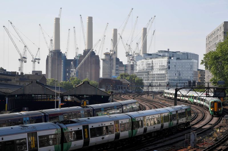 &copy; Reuters. Trains pass near construction work taking place around Battersea Power Station in London, Britain, May 22, 2018. REUTERS/Toby Melville