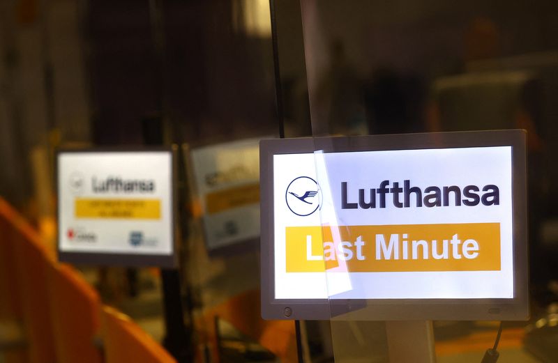 &copy; Reuters. FILE PHOTO: Signs of German air carrier Lufthansa placed at their closed counters as Lufthansa pilots start a strike over a wage dispute, at the airport in Frankfurt), Germany, September 2, 2022. REUTERS/Kai Pfaffenbach