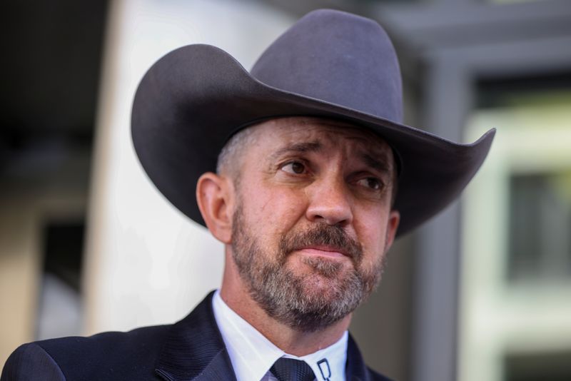 &copy; Reuters. FILE PHOTO: Couy Griffin founder of "Cowboys for Trump"  organization and commissioner of Otero County, New Mexico looks on as he speaks to media after leaving federal court in Washington, U.S., June  17, 2022. REUTERS/Tasos Katopodis