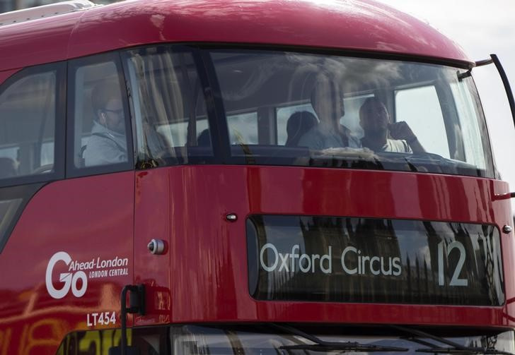 © Reuters. A Go Ahead bus crosses Westminster Bridge in London, Britain. REUTERS/Neil Hall