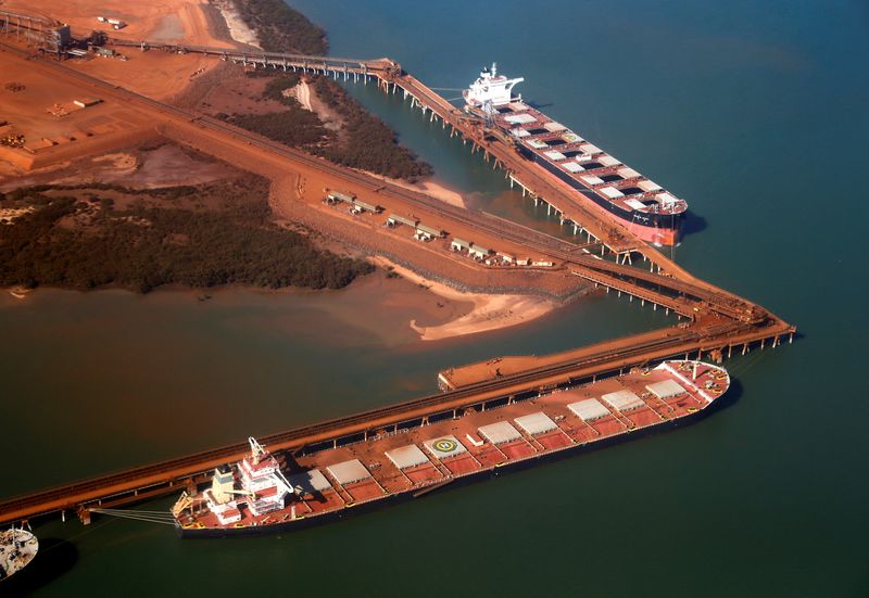 &copy; Reuters. FILE PHOTO: Ships waiting to be loaded with iron ore are seen at the Fortescue loading dock located at Port Hedland, in the Pilbara region of Western Australia December 3, 2013. REUTERS/David Gray/File Photo