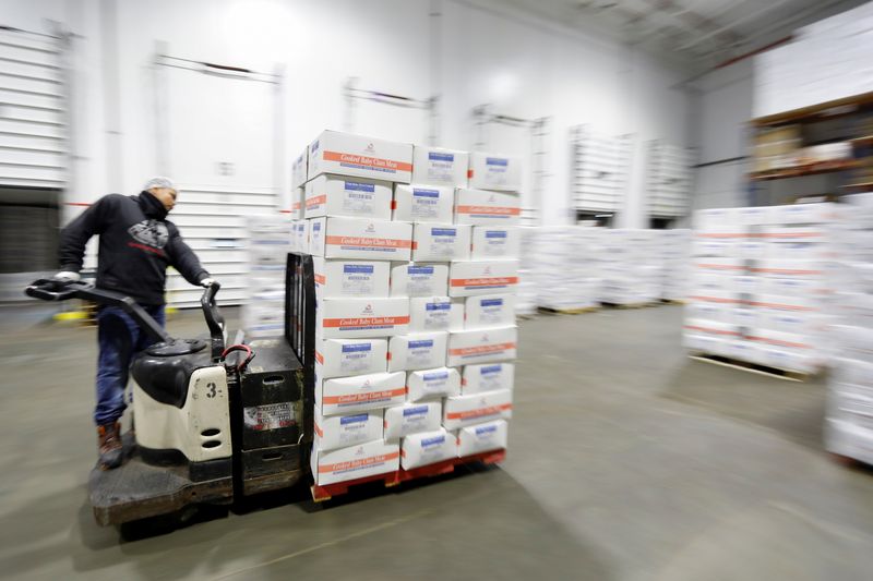 &copy; Reuters. A forklift operator moves a pallet of Imported frozen seafood from China inside the refrigerated warehouse at Pacific American Fish Company imports (PAFCO) in Vernon, California, U.S. September 25, 2018. Picture taken September 25, 2018. REUTERS/Mike Blak