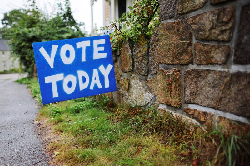 &copy; Reuters. FILE PHOTO: A sign reminds voters to cast their ballots on Primary Election Day in Gloucester, Massachusetts, U.S., September 6, 2022.     REUTERS/Brian Snyder