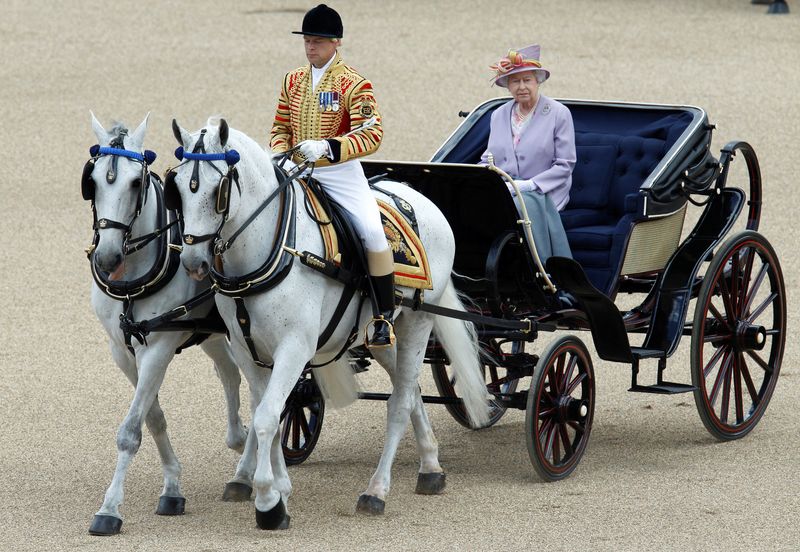 &copy; Reuters. FILE PHOTO: Britain's Queen Elizabeth rides in an open carriage as she attends the Trooping the Colour ceremony in London, Britain, June 12, 2010.  REUTERS/Luke MacGregor/