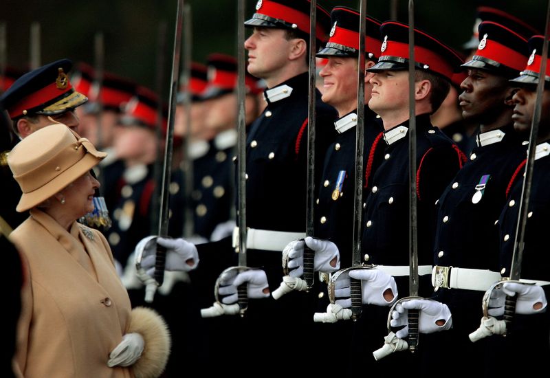 &copy; Reuters. FILE PHOTO: Britain's Queen Elizabeth smiles with Prince Harry during the Sovereign's Parade at the Royal Military Academy in Sandhurst, southern England, Britain, April 12, 2006. REUTERS/Dylan Martinez/File Photo