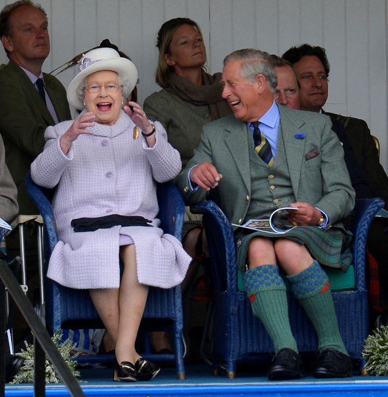 &copy; Reuters. FILE PHOTO: Members of Britain's royal family Queen Elizabeth and Prince Charles cheer as competitors participate in a sack race at the Braemar Gathering in Braemar, Scotland, Britain, September 1, 2012. REUTERSRussell Cheyne/File Photo