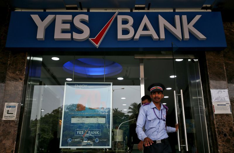 &copy; Reuters. FILE PHOTO: A watchman steps out of a Yes Bank branch in Mumbai, India, September 21, 2018. REUTERS/Francis Mascarenhas