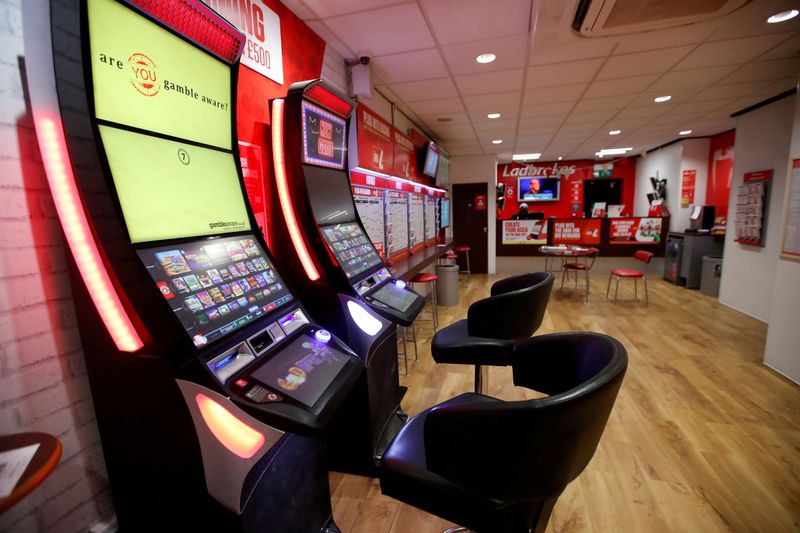 © Reuters. FILE PHOTO: General view inside a Ladbrokes shop in Harpenden, Britain, March 18, 2020. REUTERS/Peter Cziborra/File Photo/File Photo