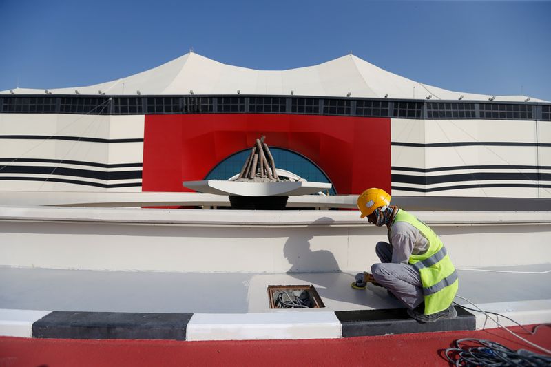 &copy; Reuters. FILE PHOTO: A worker puts final touches at Al Bayt Stadium, one of the venues of the Qatar World Cup 2022, in Al Khor, Qatar, November 17, 2021.  REUTERS/Hamad I Mohammed/File Photo