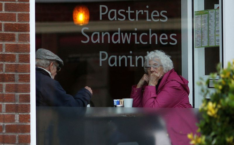 &copy; Reuters. FILE PHOTO: An elderly couple sit inside a coffee shop in Macclesfield, northern England February 19, 2015. REUTERS/Phil Noble/File Photo