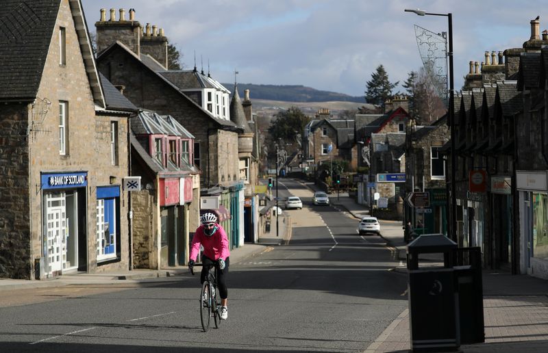 &copy; Reuters. A cyclist is seen riding in Pitlochry, Scotland, Britain, March 28, 2020. REUTERS/Russell Cheyne