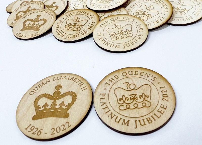 &copy; Reuters. View of LulaandGray's wooden Queen Elizabeth tokens displayed in Macclesfield, Britain in this undated handout image. Courtesy of Laura Sheldon/Handout via REUTERS 