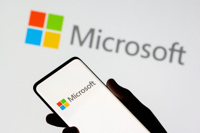 &copy; Reuters. FILE PHOTO: Smartphone is seen in front of Microsoft logo displayed in this illustration taken, July 26, 2021. REUTERS/Dado Ruvic/Illustration