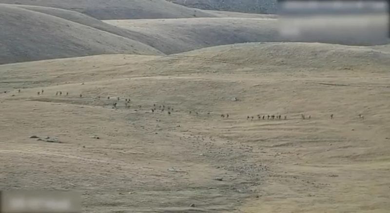 &copy; Reuters. A still image from video, released by the Armenian Defence Ministry, shows what it said to be Azerbaijani service members moving along an unidentified mountainous border area with Armenia, in this still image taken from handout footage released September 