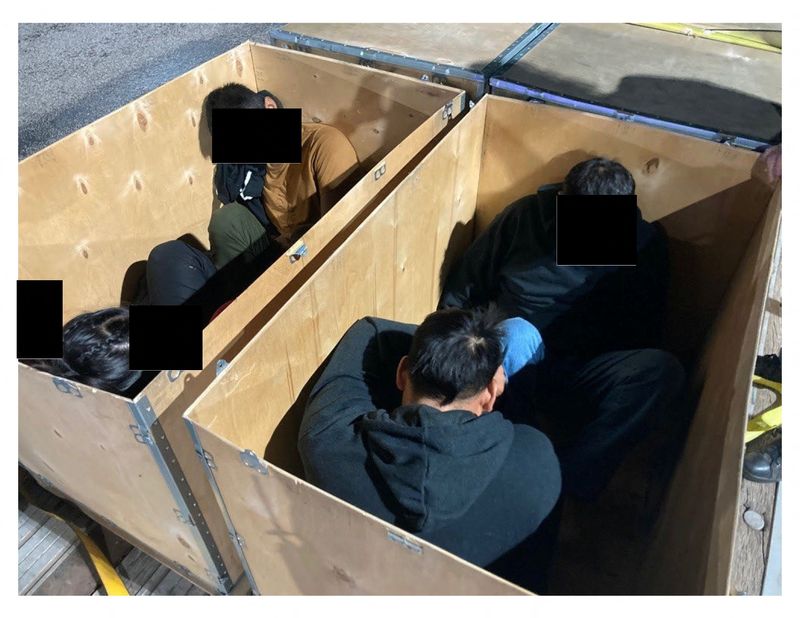 © Reuters. Migrants who are believed to have crossed the border from Mexico into the United States after leaving their homes in Mexico, Guatemala or Colombia are seen inside wooden boxes after the flatbed  truck carrying the boxes was interdicted by law enforcement officers in Texas, in this undated police photo submitted into evidence in U.S. District Court as part of a series of indictments of alleged human smugglers in Laredo, Texas, U.S. September 13, 2022. U.S. Justice Department/Handout via REUTERS 