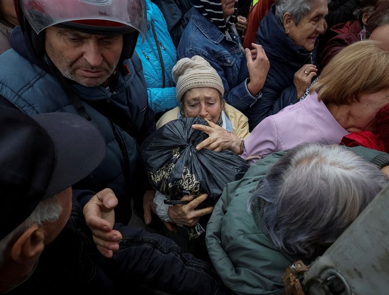 In liberated Ukraine town, locals sob with relief, relate harrowing accounts