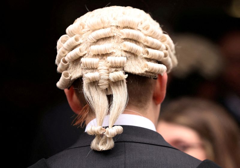 &copy; Reuters. FILE PHOTO: A barrister is seen during a strike by criminal barristers outside Manchester Crown Court in Manchester, Britain, June 27, 2022. REUTERS/Phil Noble/