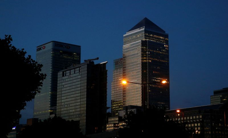 &copy; Reuters. FILE PHOTO: Office lights are on in banks as dawn breaks behind the financial district of Canary Wharf, in London, Britain June 24, 2016.       REUTERS/Neil Hall/File Photo