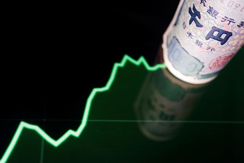 &copy; Reuters. Un billete de yen japonés con un gráfico del tipo de cambio de la moneda en esta foto ilustrativa tomada el 16 de junio de 2022