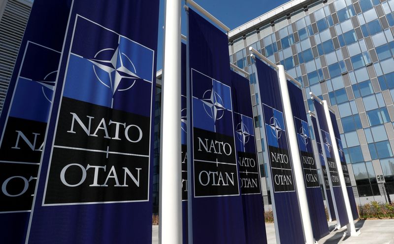 &copy; Reuters. FILE PHOTO: Banners displaying the NATO logo are placed at the entrance of new NATO headquarters during the move to the new building, in Brussels, Belgium April 19, 2018.  REUTERS/Yves Herman/