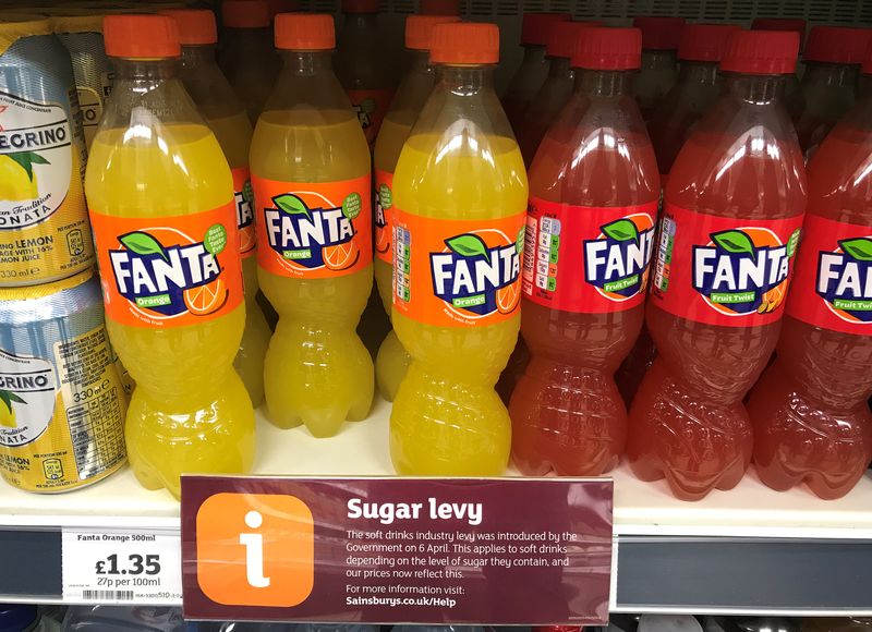 &copy; Reuters. A sign informing shoppers about the UK sugar Levy is seen on a shelf of Fanta soft drinks inside a Sainsbury's supermarket in Manchester, Britain, April 14, 2018. REUTERS/Phil Noble