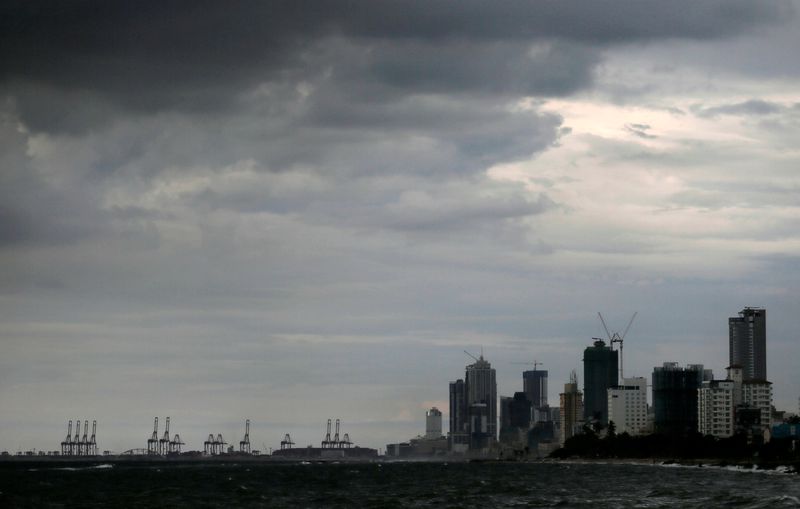 &copy; Reuters. FILE PHOTO: A general view of the main business district as rain clouds gather above in Colombo, Sri Lanka, November 17, 2020. REUTERS/Dinuka Liyanawatte