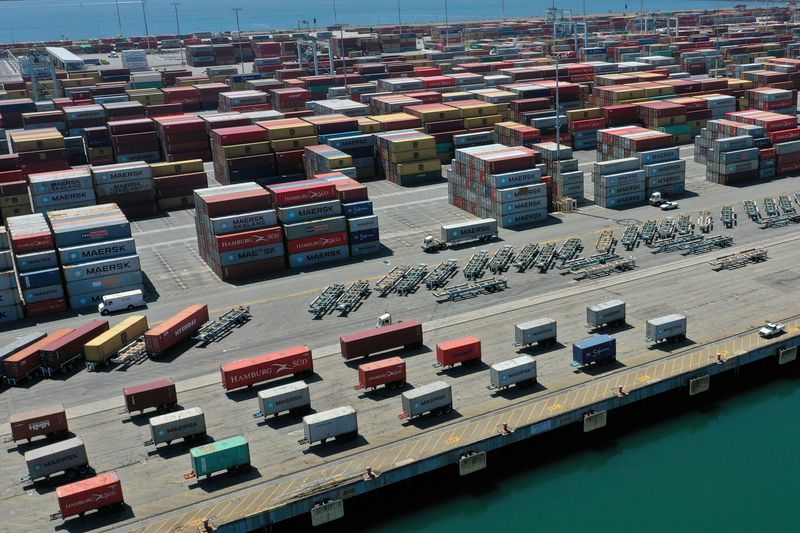 &copy; Reuters. FILE PHOTO: Containers are seen on a shipping dock, as the global outbreak of the coronavirus disease (COVID-19) continues, in the Port of Los Angeles, California, U.S., April 16, 2020. REUTERS/Lucy Nicholson