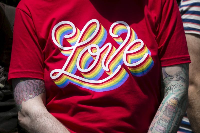 &copy; Reuters. FILE PHOTO - A spectator wears a shirt with the word 'LOVE' on it while watching the San Francisco gay pride parade two days after the U.S. Supreme Court's landmark decision that legalized same-sex marriage throughout the country in San Francisco, Califor