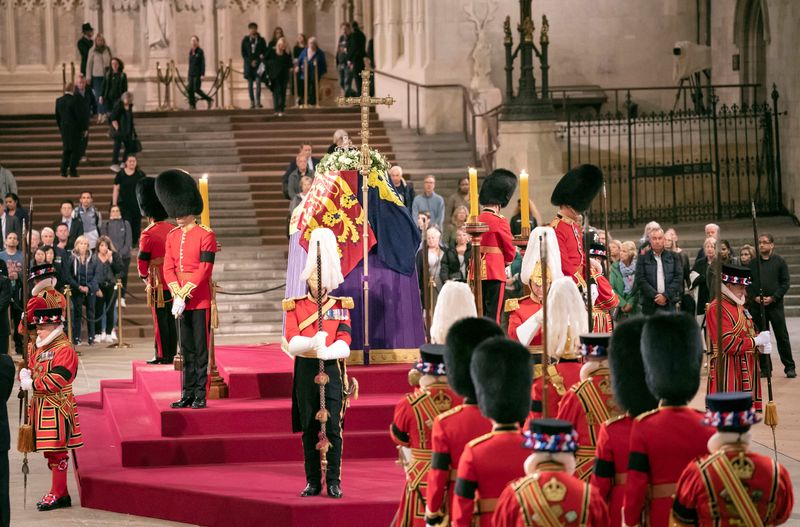 King Charles stands vigil as queen's lying-in-state queue swells