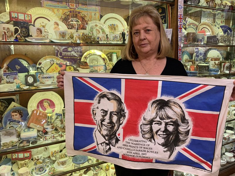 &copy; Reuters. Australia's largest British royal memorabilia collector Jan Hugo stands near her collection holding the tea-towel she held when she met Britain's King Charles III and Queen Camilla when they toured Sydney in 2015, in Nulkaba, Australia September 15, 2022.