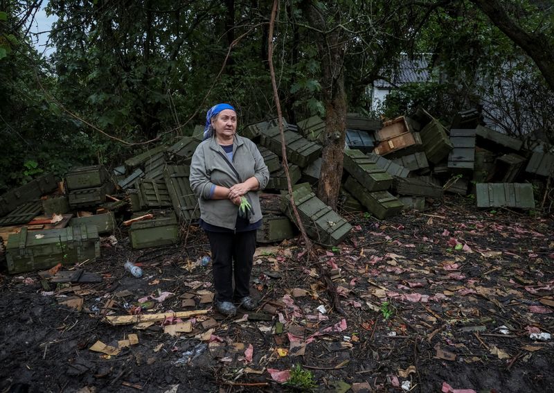 Residents begin clean-up in re-captured Ukrainian village