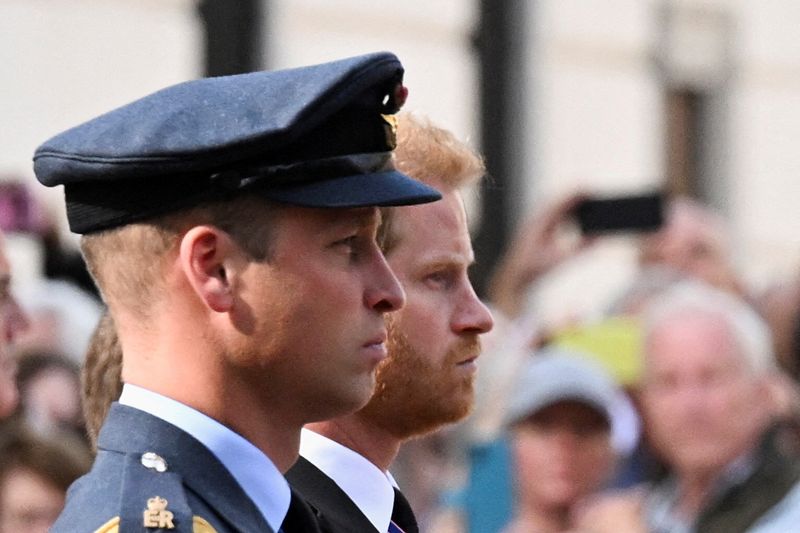 &copy; Reuters. Britain's William, Prince of Wales and Prince Harry march during a procession where the coffin of Britain's Queen Elizabeth is transported from Buckingham Palace to the Houses of Parliament for her lying in state, in London, Britain, September 14, 2022.  