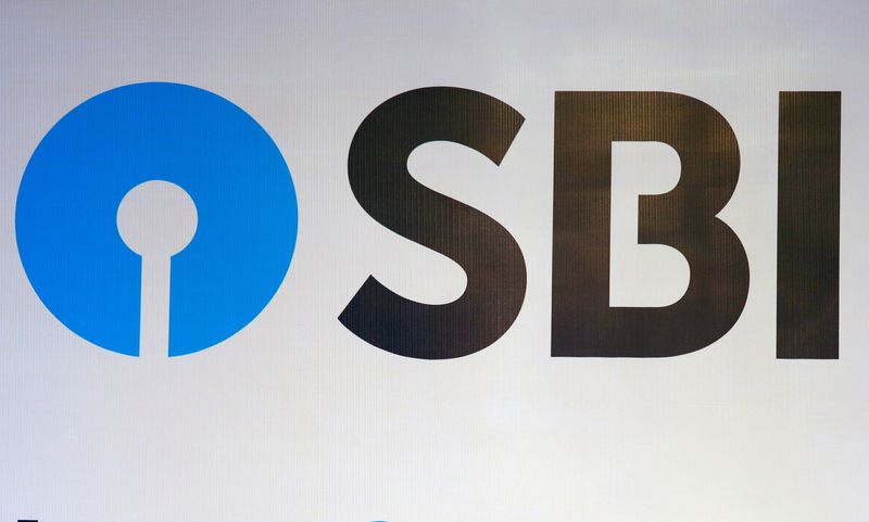 &copy; Reuters. FILE PHOTO: The new logo of State Bank of India (SBI) is pictured at the podium of the venue of a news conference after the announcement of SBI's fourth quarter results, in Kolkata, India May 19, 2017. REUTERS/Rupak De Chowdhuri