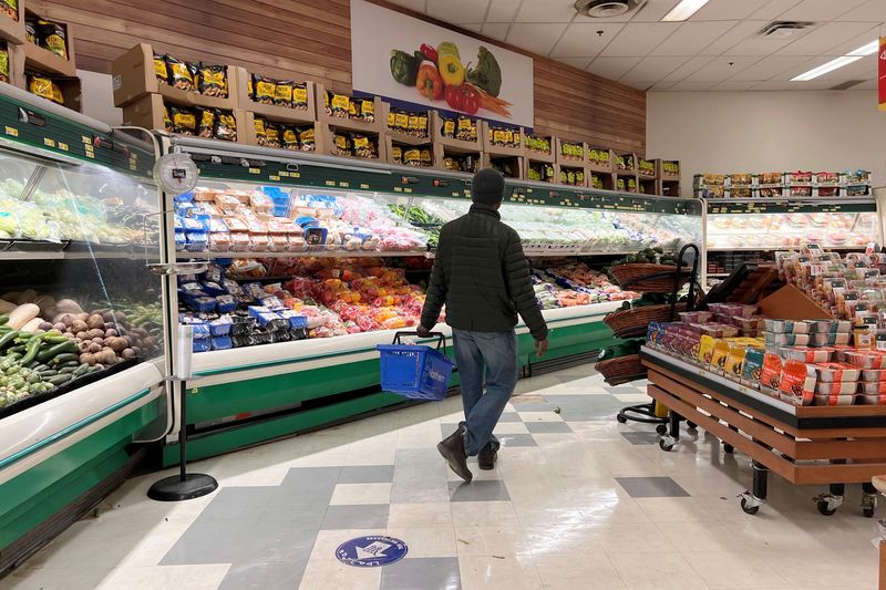 © Reuters. FILE PHOTO: A person shops at the North Mart grocery store in Iqaluit, Nunavut, Canada July 28, 2022. REUTERS/Carlos Osorio