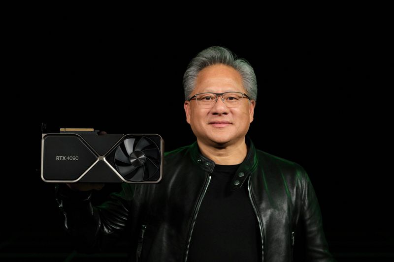 © Reuters. Nvidia Corp CEO Jensen Huang holds one of the company's new RTX 4090 chips for computer gaming in this undated handout photo provided September 20, 2022. Courtesy of Nvidia Corp/Handout via REUTERS 