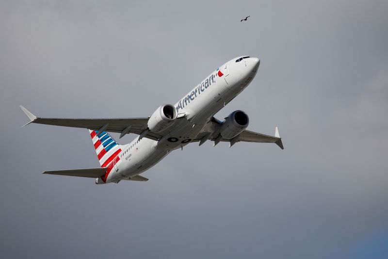 &copy; Reuters. FILE PHOTO: American Airlines flight 718, the first U.S. Boeing 737 MAX commercial flight since regulators lifted a 20-month grounding in November, takes off from Miami, Florida, U.S. December 29, 2020.  REUTERS/Marco Bello