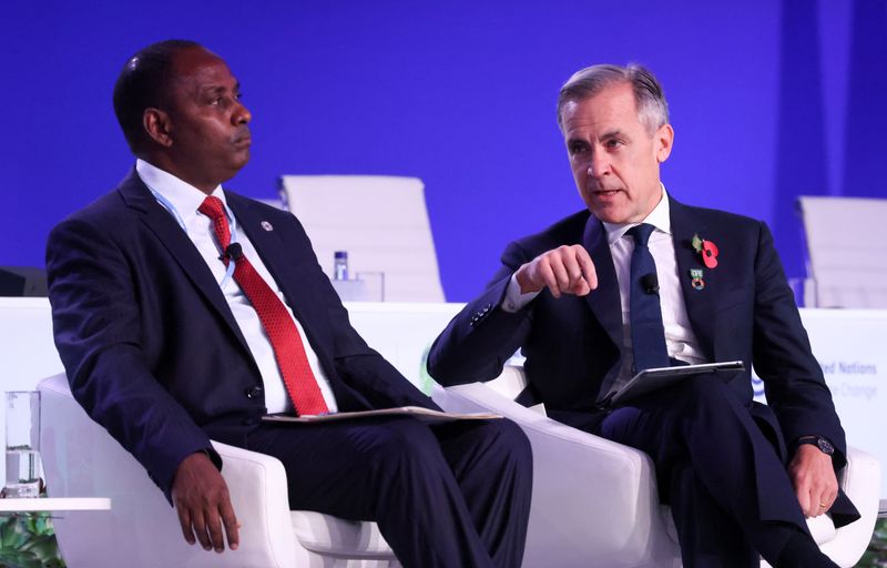 &copy; Reuters. Kenya's Finance Minister Ukur Yatani and former Bank of England Governor Mark Carney attend the UN Climate Change Conference (COP26) in Glasgow, Scotland, Britain, November 3, 2021. REUTERS/Yves Herman/File Photo